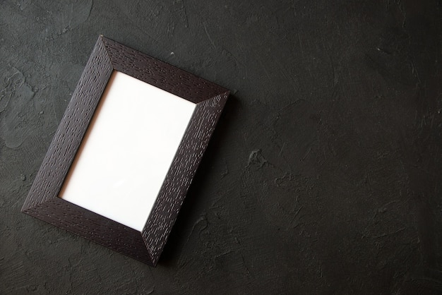 Top view of picture frame on dark wall