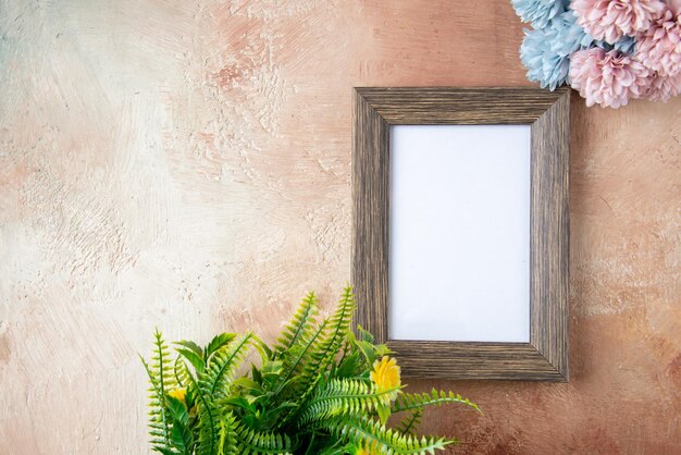 Top view picture frame with flowers on light background couple color gift present valentines day feeling marriage