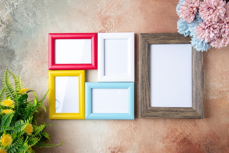 Free Photo top view picture frames with flowers on light background couple colors gift present valentines day love feeling marriage
