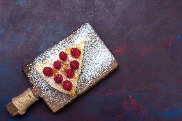 Top view piece of cake baked sweet with raspberries on the dark desk