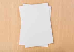 Free photo top view of pieces of paper on wooden table