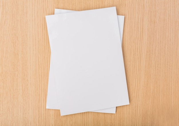 Top view of pieces of paper on wooden table