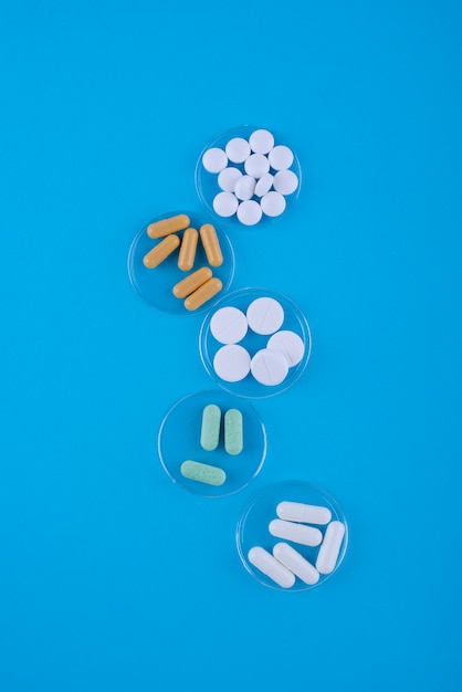 Top view pills on blue background