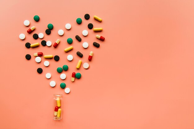 Top view pills making a heart