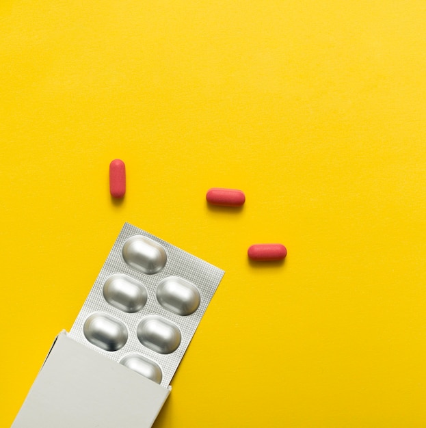 Top view of pills with foil and box