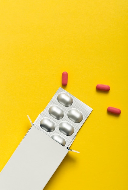 Top view of pills with foil and copy space