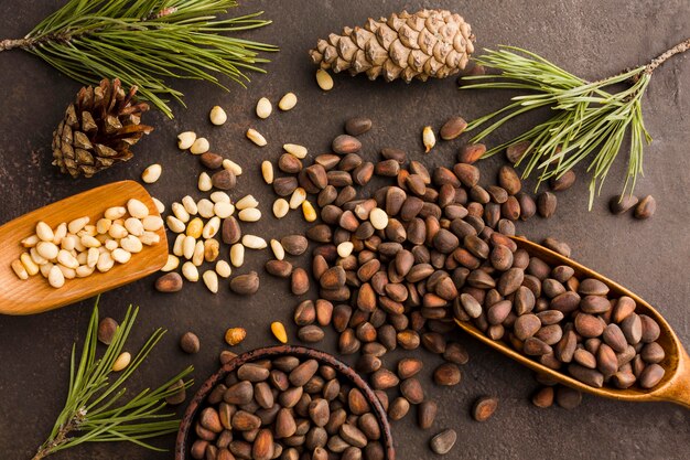 Top view pine seeds with wooden spoon