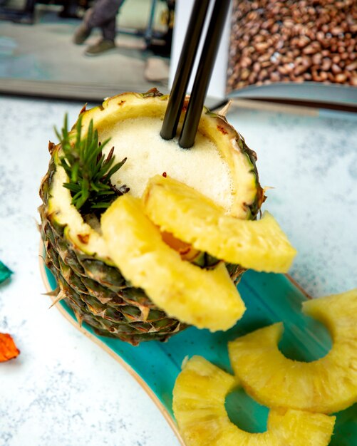 Top view of pineapple juice in pineapple skin