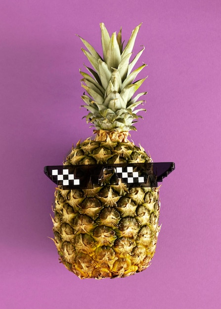 Top view pineapple wearing glasses