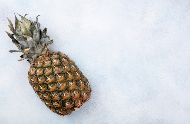 Top view of pineapple on white surface