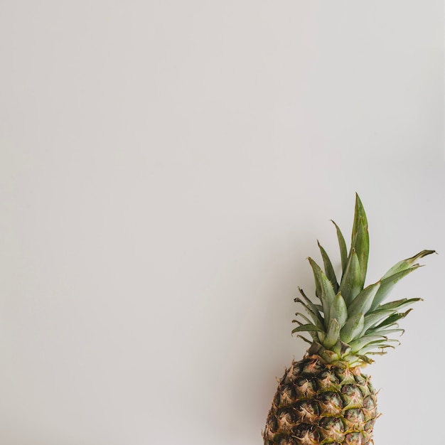 Top view of pineapple on white surface
