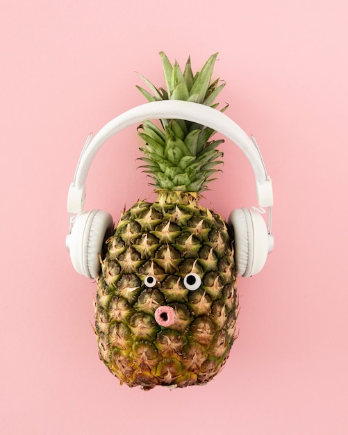 Top view pineapple with headphones