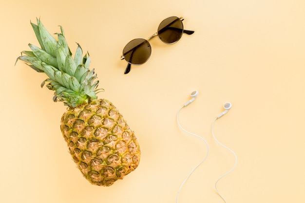 Top view pineapple with sunglasses