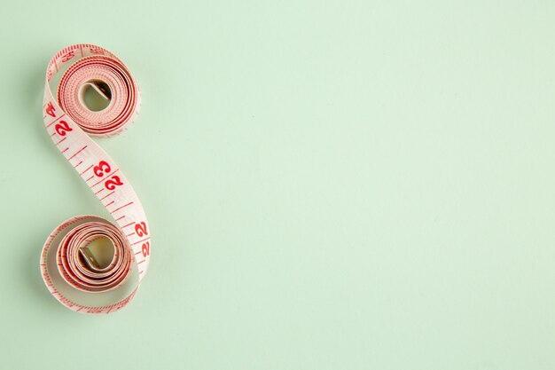 top view pink centimeter on green background