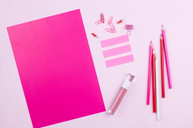 Top view pink desk concept 