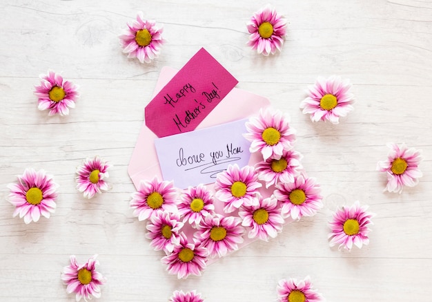 Top view pink flowers on wooden table