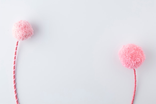 Top view pink pom poms arrangement with copy space