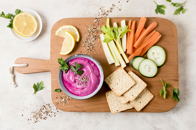 Top view of pink sauce with vegetables