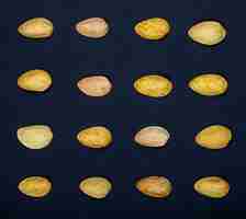 Free photo top view of pistachio nuts isolated on a black background