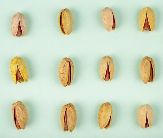 Top view of pistachio nuts isolated on a white background