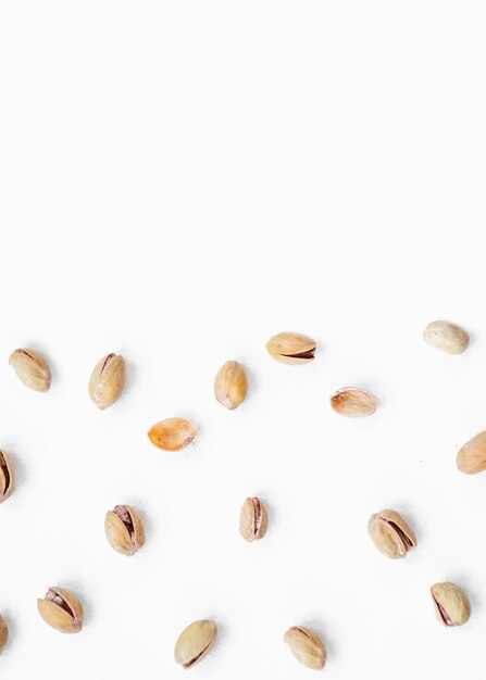 Top view of pistachio spread on white background