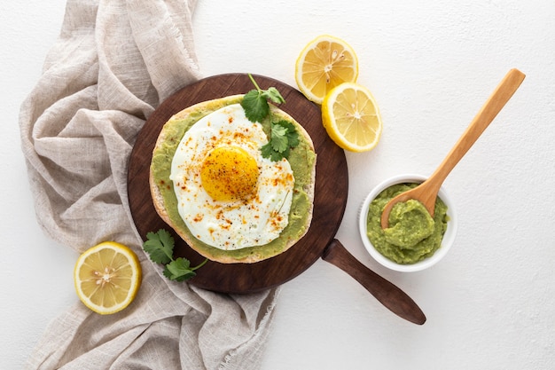 Top view pita with avocado spread and fried egg