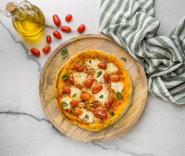 Top view of pizza with tomatoes and oil