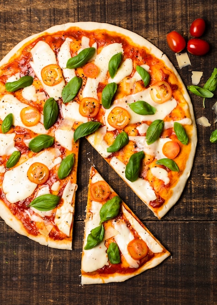 Top view of pizza on wooden table