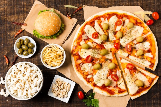 Top view of pizza on wooden table