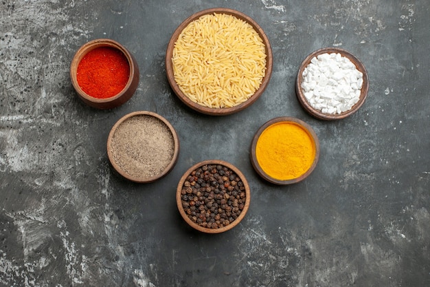 Top view of plain boiled rice with different spices