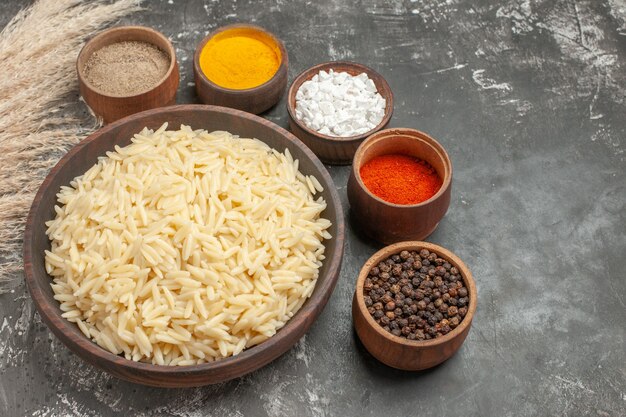 Top view of plain boiled rice with different spices