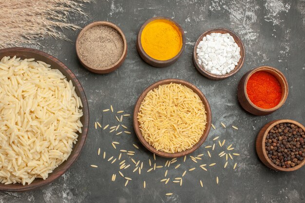 Top view of plain boiled rice with different spices