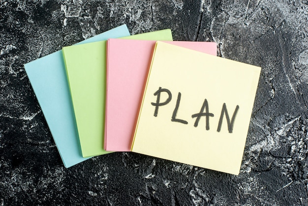 annual operating plan images Free photo top view plan written note with colorful stickers on dark gray background