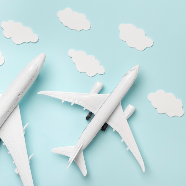 Free photo top view plane toys on blue background