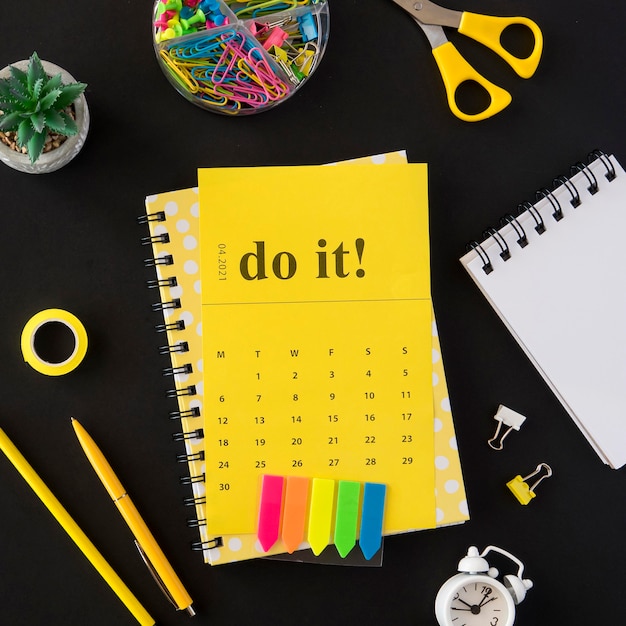 Free photo top view planner yellow do it calendar