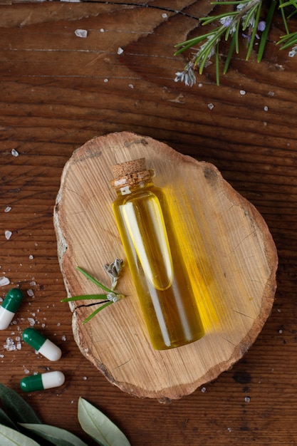 Top view plastic bottle with oil and capsules on the table