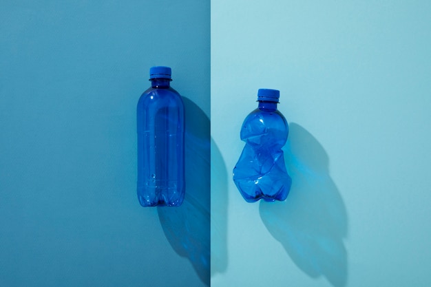 Free photo top view plastic bottles arrangement