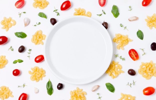 Top view plate surrounded by vegetables