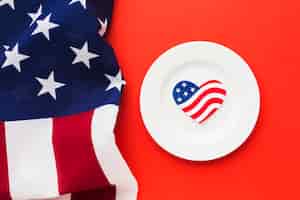 Free photo top view of plate with american flags