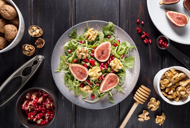 Top view of plate with autumn fig salad and walnuts