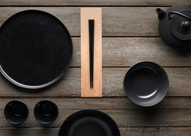 Top view of plate with chopsticks and teapot