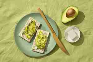 Free photo top view of plate with keto diet food and avocado