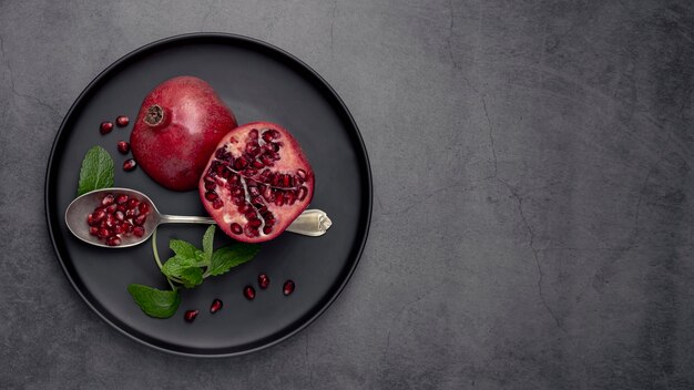 Top view of plate with mint and pomegranate