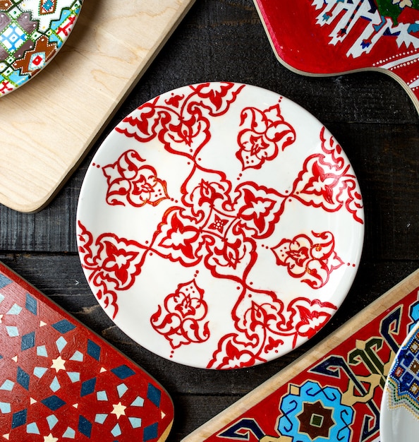 Free photo top view of plate with ornaments in red