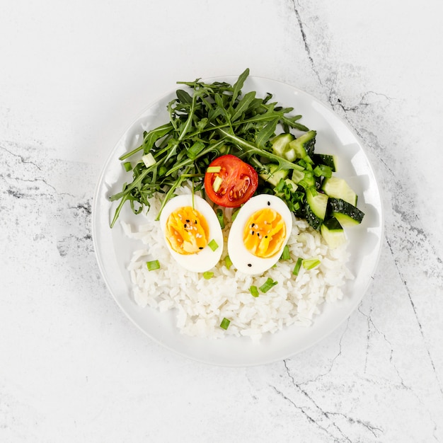 Top view of plate with rice and eggs