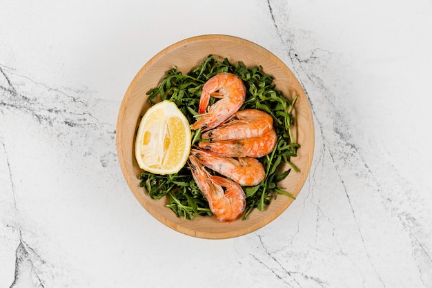 Free photo top view of plate with salad and shrimp