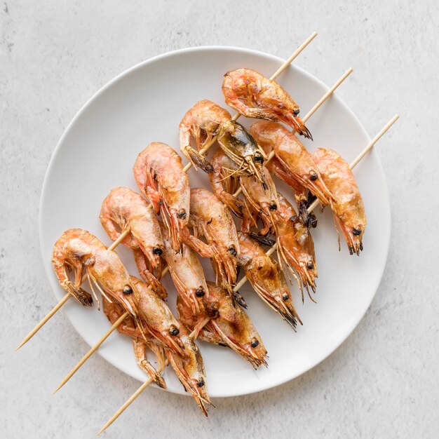 Top view plate with shrimp skewers