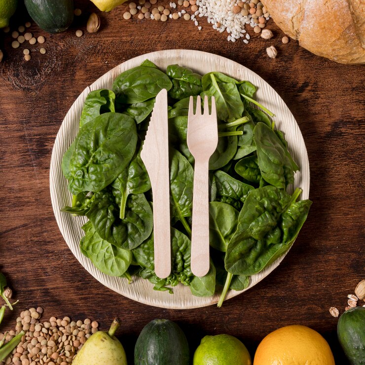 Free Photo top view plate with spinach leaves