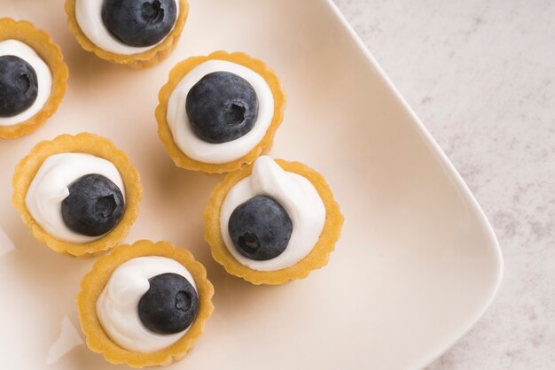 Top view plate with sweet muffins