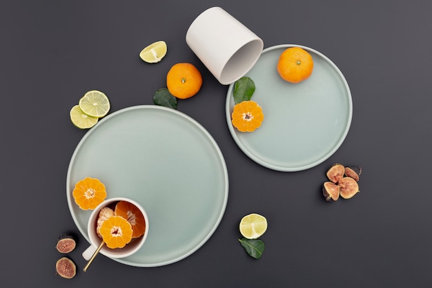 Top view of plate with tangerine slices and figs